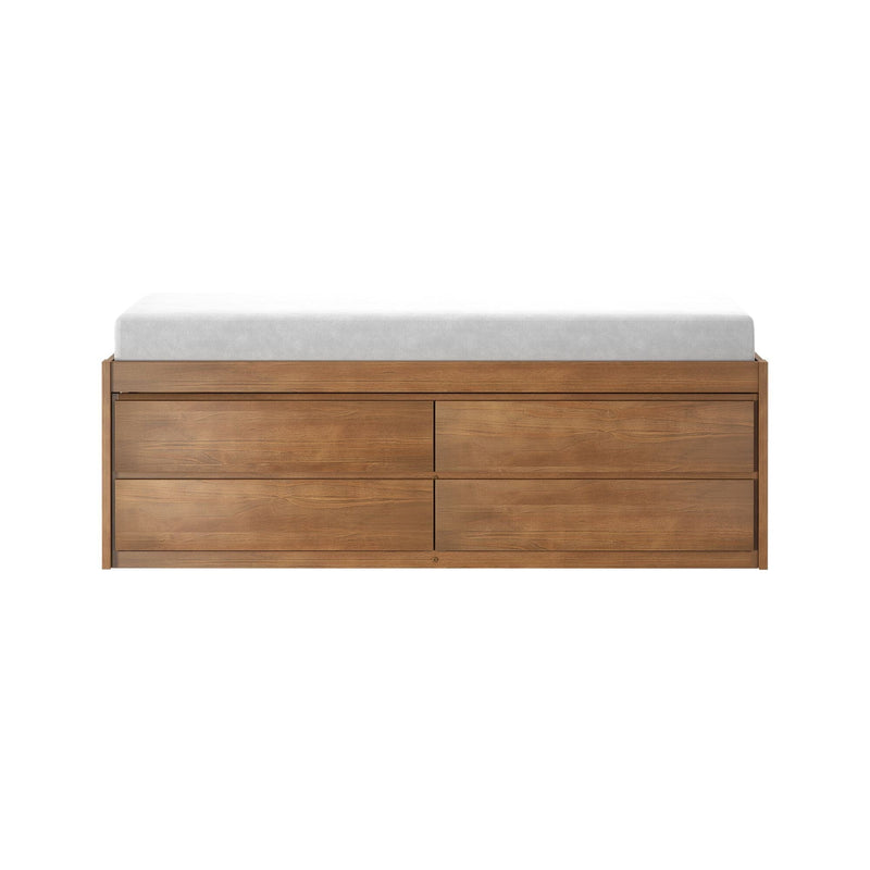 Mid-century modern walnut dresser with multiple storage drawers topped by a white changing pad on a white background