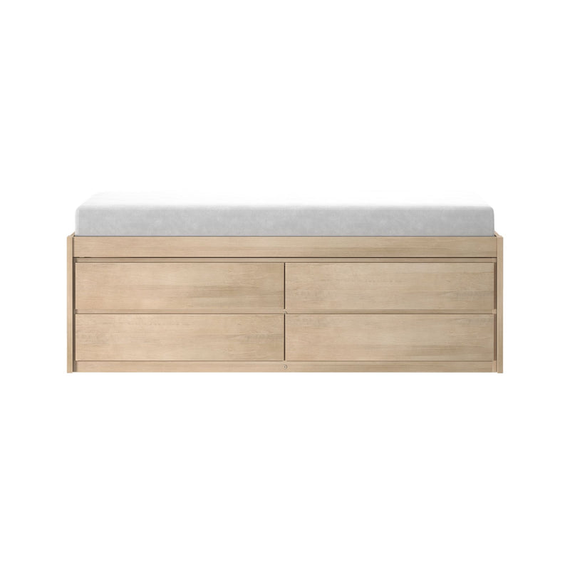 Minimalist light oak six-drawer dresser topped with a gray mattress pad on a white background
