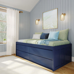 Cozy bedroom with blue daybed, decorative pillows, and wall lighting in a modern design.