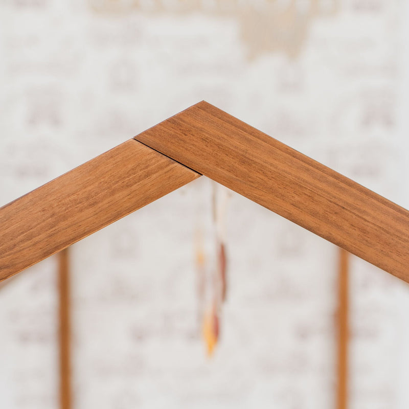 Close-up of a wooden roof joint with a blurred background.