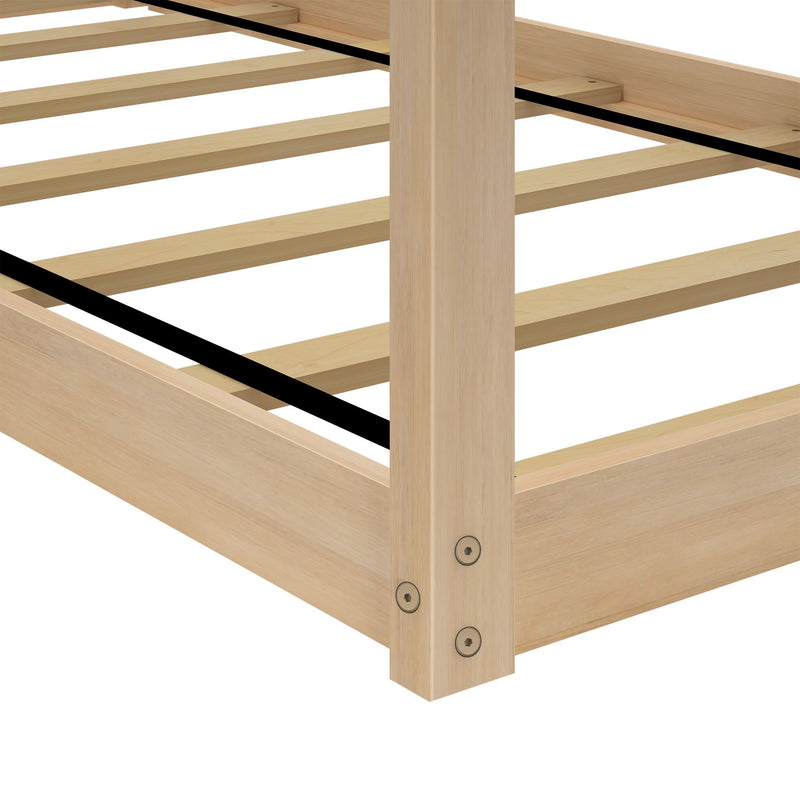 Close-up of light wood slatted bed frame (platform bed base) with center support strap and corner post, natural wood finish