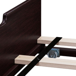 Close-up of a dark wooden bed frame showing sturdy construction and wheel casters for easy movement.