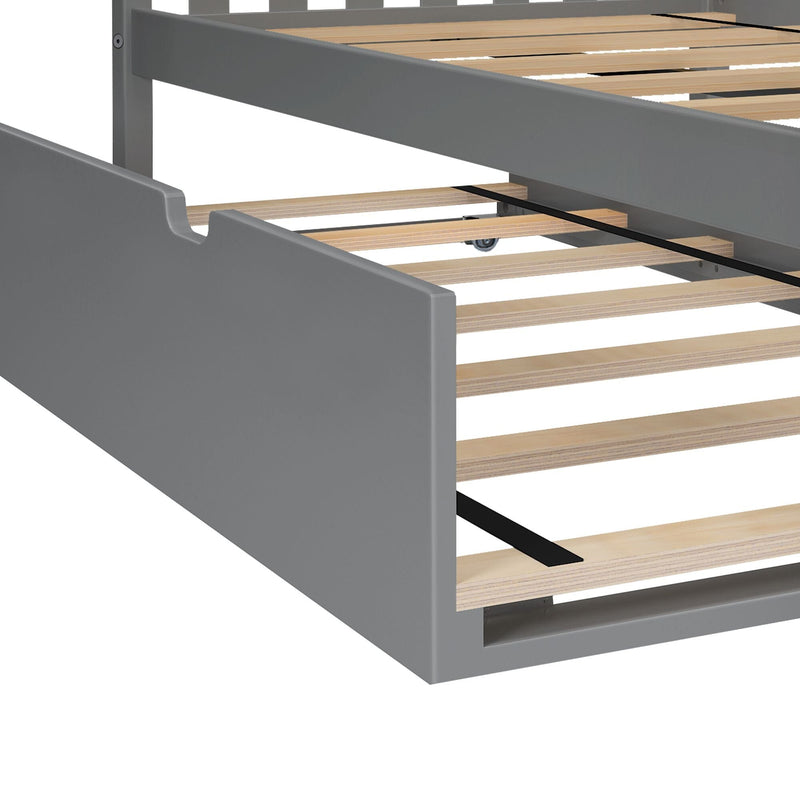 Gray platform bed frame with wooden slatted base, central support strap and pull-out trundle caster
