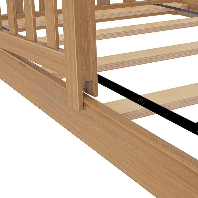 Close-up of solid oak platform bed frame with wooden slatted base and black metal center support rail, natural oak finish
