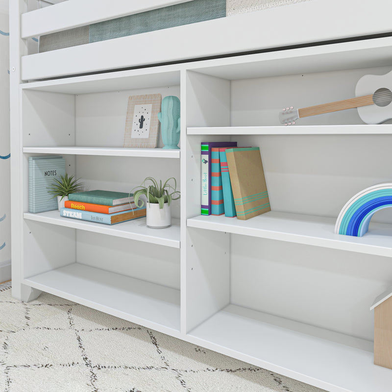 White built-in bookshelf under bunk bed in kids' bedroom with colorful books, notebooks, potted plants, decorative cactus figurine and small white guitar