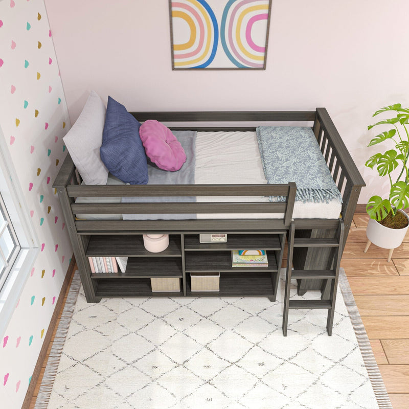 Gray wooden loft bed with built-in storage shelves, pastel pillows and floral throw in a pink kids' bedroom with patterned area rug and potted plant