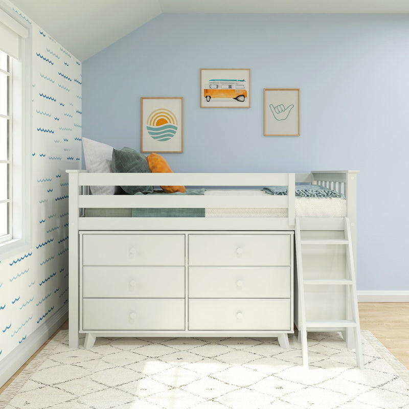 White loft bed with built-in drawers and ladder in coastal kids' bedroom, light blue walls, wave wallpaper and surf-themed framed art