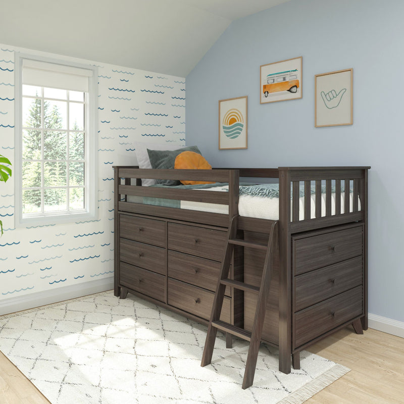 Dark wood kids loft bed with built-in drawers and ladder in coastal-themed bedroom with blue wave wallpaper and surf art