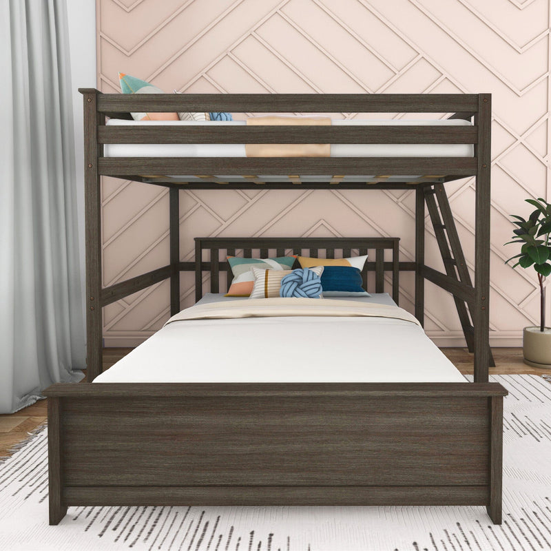 Dark wood twin-over-twin bunk bed with ladder, white bedding and colorful throw pillows in a modern kids bedroom with pink geometric accent wall and potted plant