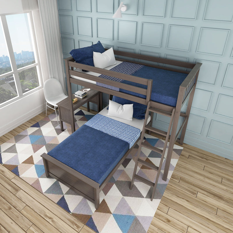 L-shaped wooden twin loft bunk bed with ladder, blue bedding and pillows, built-in desk, geometric rug in a light-blue paneled kids' bedroom by a window