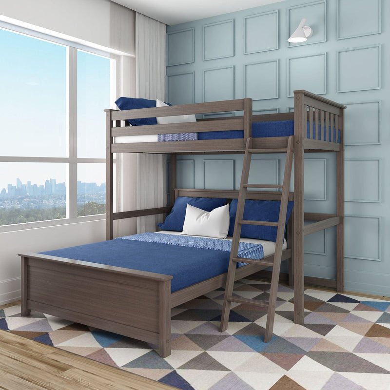 Modern gray wood twin-over-full bunk bed with ladder, blue bedding and white accent pillows in a light-blue paneled kids' bedroom with geometric rug and city-view window