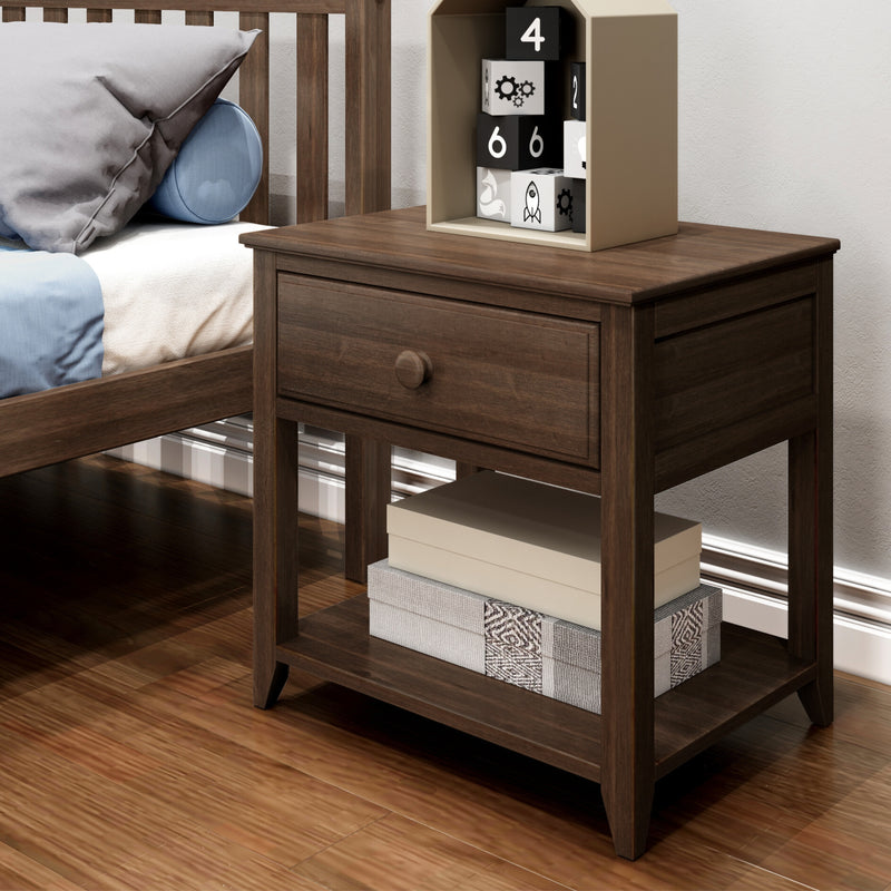 Dark wood nightstand bedside table in modern bedroom with slatted wood bed frame, blue pillows, stacked storage boxes and black-and-white toy blocks
