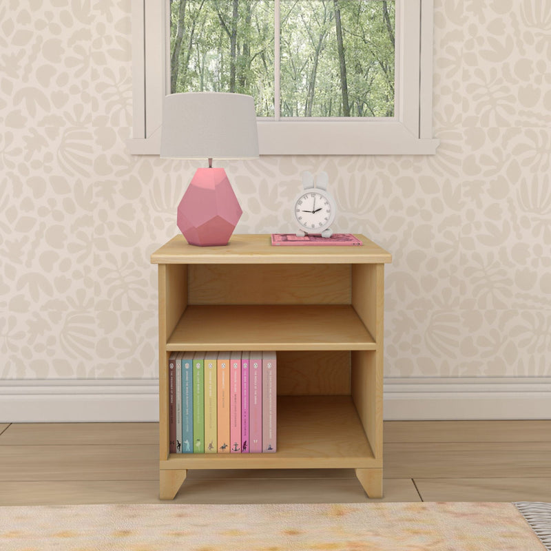 Wooden nightstand with pink lamp and books in cozy bedroom decor.