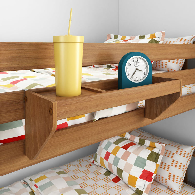 Wooden built-in bedside shelf on bunk bed with yellow straw cup, teal alarm clock and colorful geometric bedding — space-saving kids' bedroom