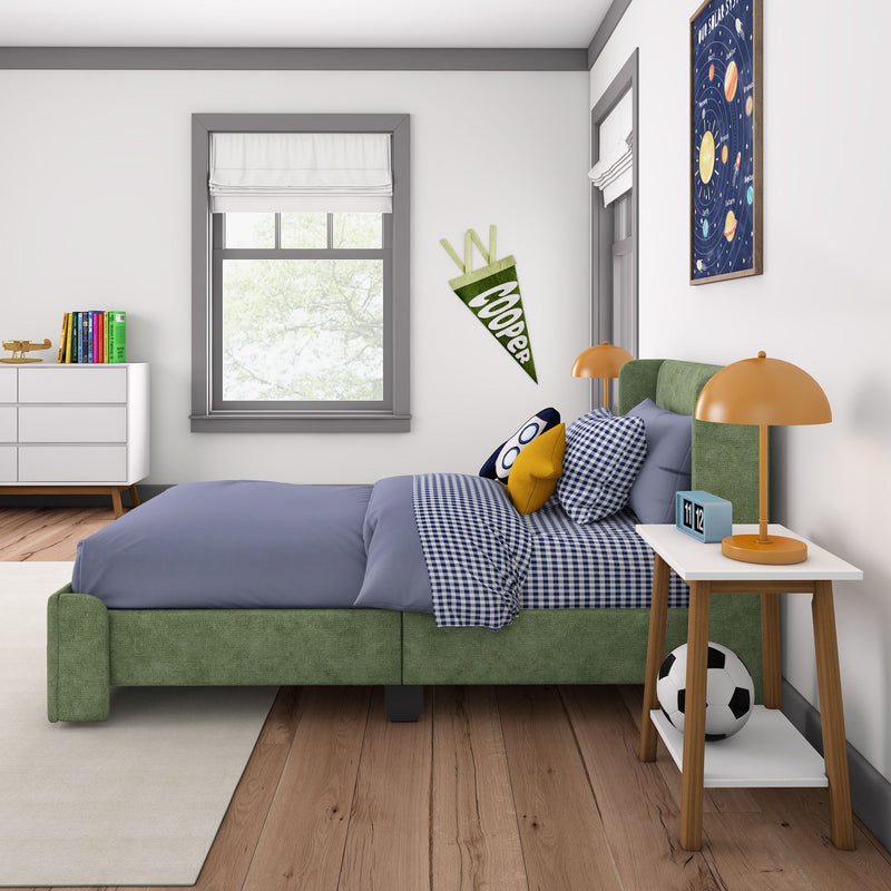 Kids bedroom decor with green upholstered bed, blue gingham bedding, orange bedside lamp, space poster, pennant and soccer ball