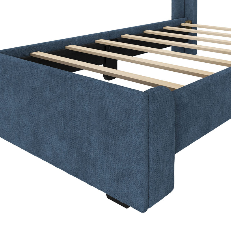 Blue upholstered platform bed frame with light wood slats and central support beam, textured fabric side rails and low-profile footboard, modern sturdy design
