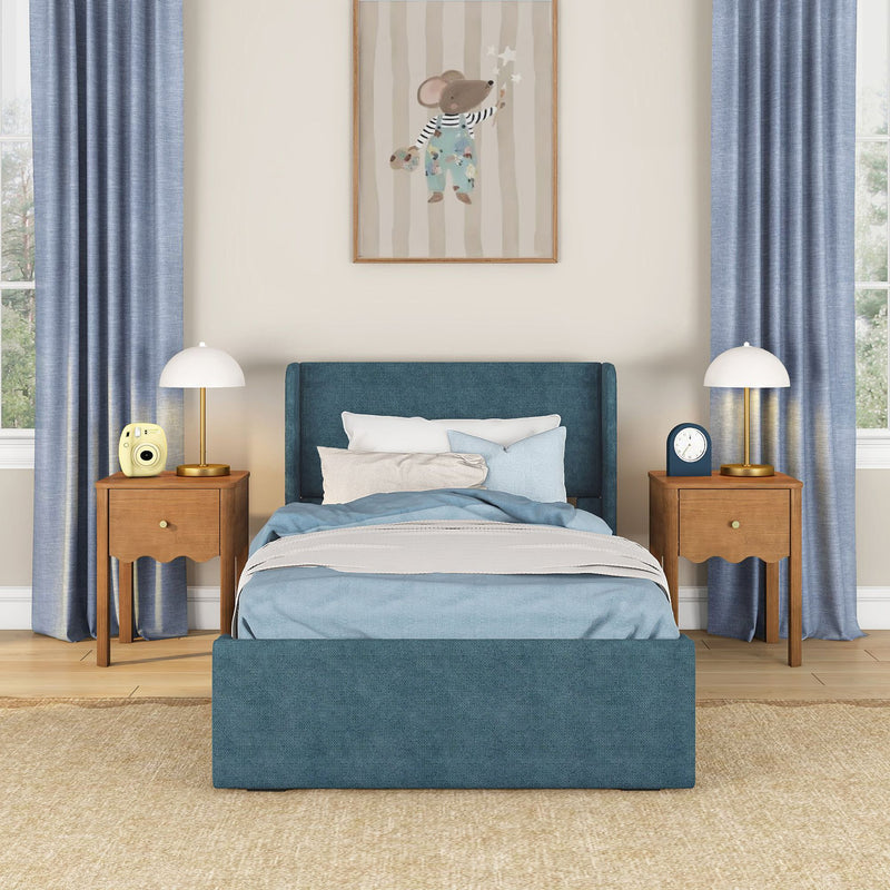 Modern blue bedroom with teal upholstered bed, wooden nightstands, gold table lamps, blue curtains and whimsical mouse wall art