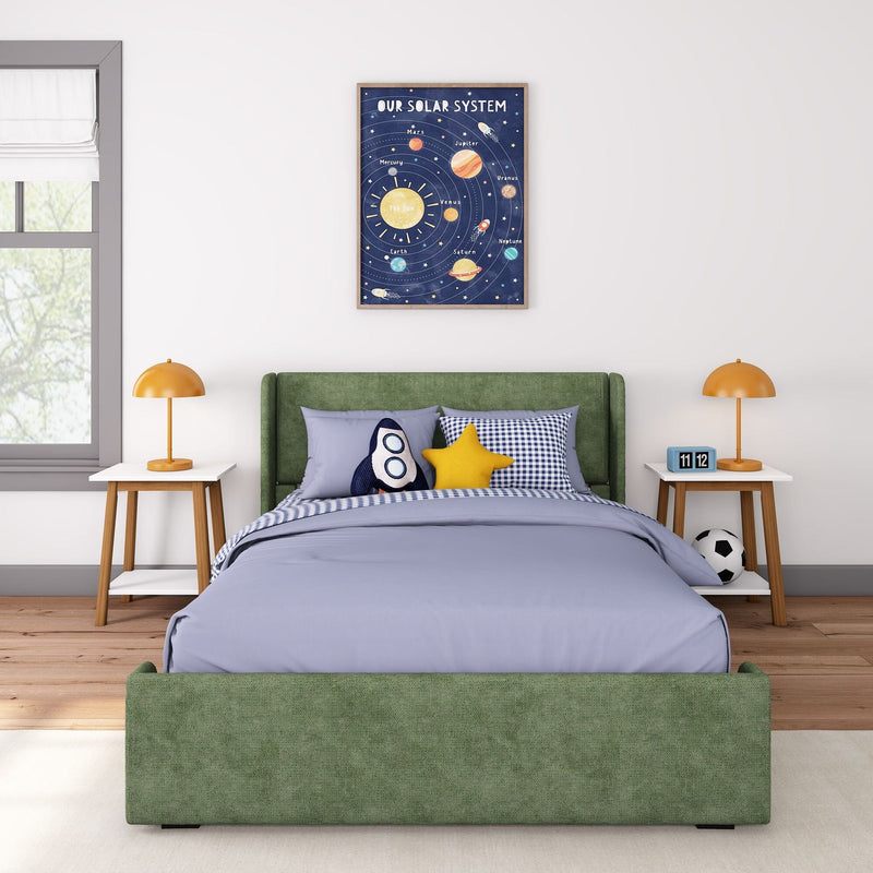 Children's space-themed bedroom with green upholstered bed, blue bedding, rocket and star pillows, framed solar system poster wall art above bed, orange bedside lamps on wooden nightstands