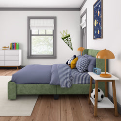 Cozy kids' bedroom with green bed frame, blue checkered bedding, and soccer decor.