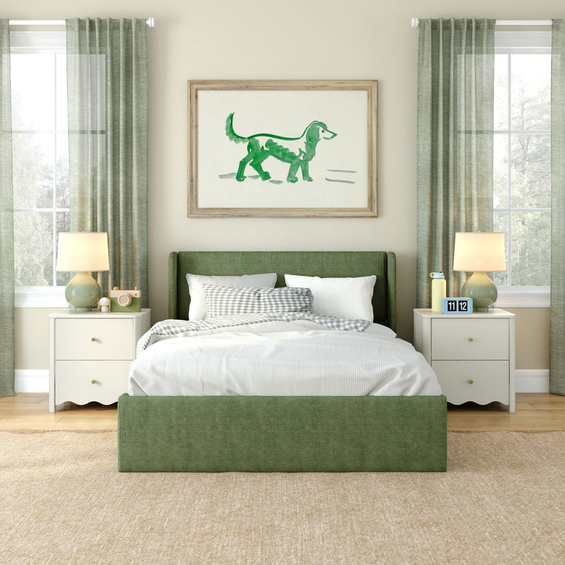Green bedroom decor with upholstered green bed, white bedding and gingham pillows, framed green watercolor dog print, matching curtains and bedside lamps