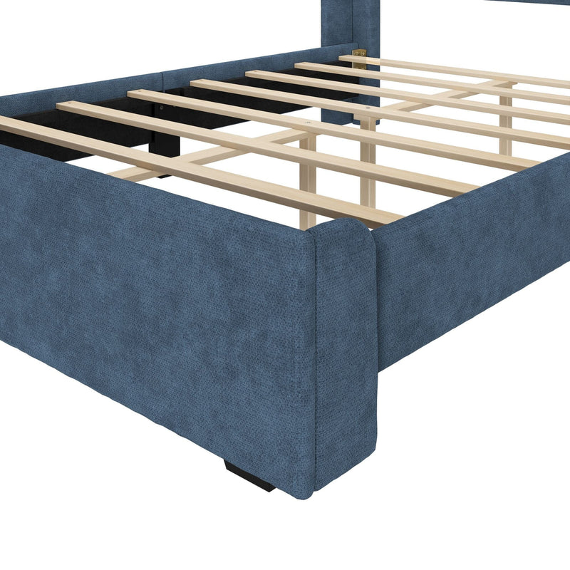 Blue upholstered platform bed frame with wooden slat support and center legs, textured fabric upholstery providing a sturdy mattress foundation (no box spring required)
