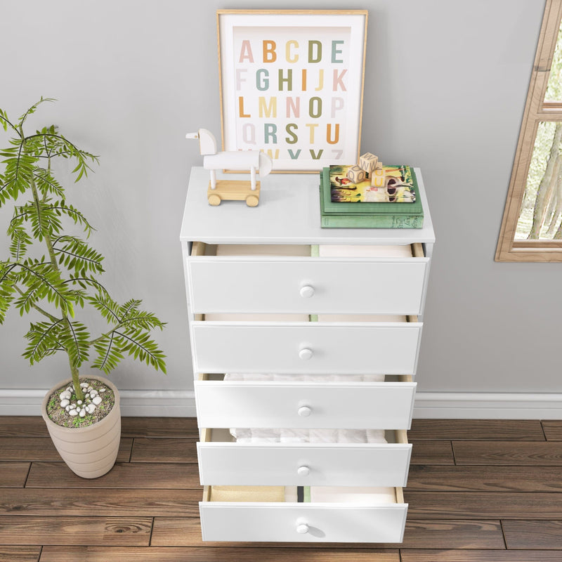 White five-drawer nursery dresser with open drawers on hardwood floor, alphabet print, wooden toy horse and potted plant