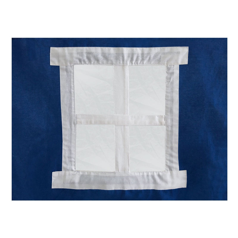 Blue fabric with a white cross-shaped pattern, textile design detail.