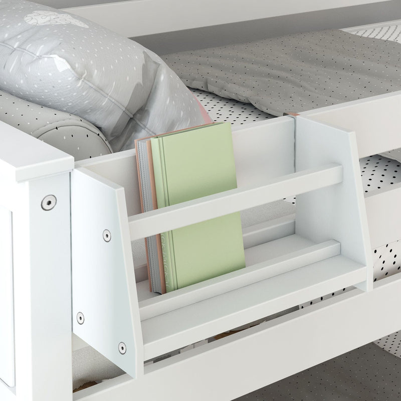 White wooden kids bunk bed with built-in ladder bookshelf holding a pastel green book, polka-dot sheets and gray pillow — modern space-saving children's bedroom storage solution