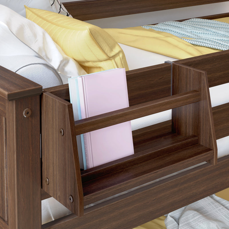 Walnut wooden bed with built-in bookshelf organizer holding pastel pink and blue books, yellow accent pillow and folded blanket on white mattress