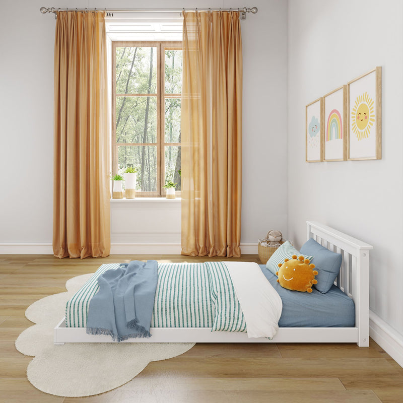 Minimalist children's bedroom with wooden floor, orange curtains, and a white bed featuring blue striped bedding and a smiling sun pillow.