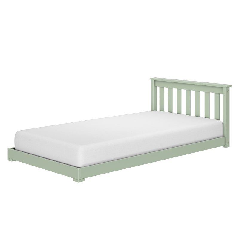 Light green wooden twin bed frame with vertical slatted headboard and white mattress on white background