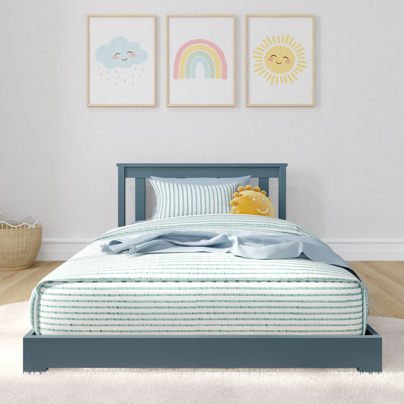Blue kids bed with striped bedding and sun plush under three pastel nursery prints (cloud, rainbow, sun)