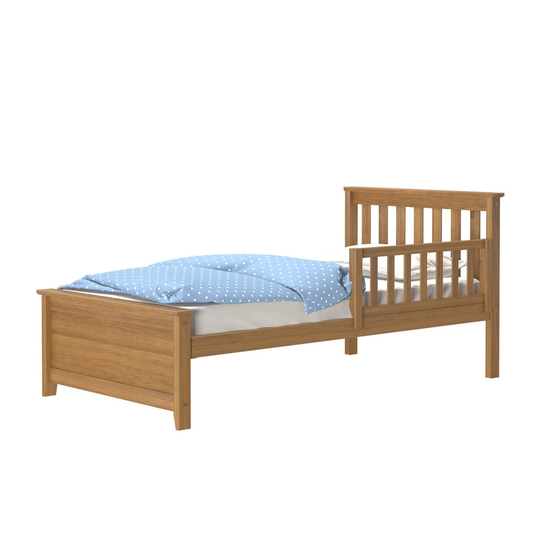 Oak wooden toddler bed frame with slatted headboard and removable side guard rail, single-size children's bed with blue polka-dot duvet on white background
