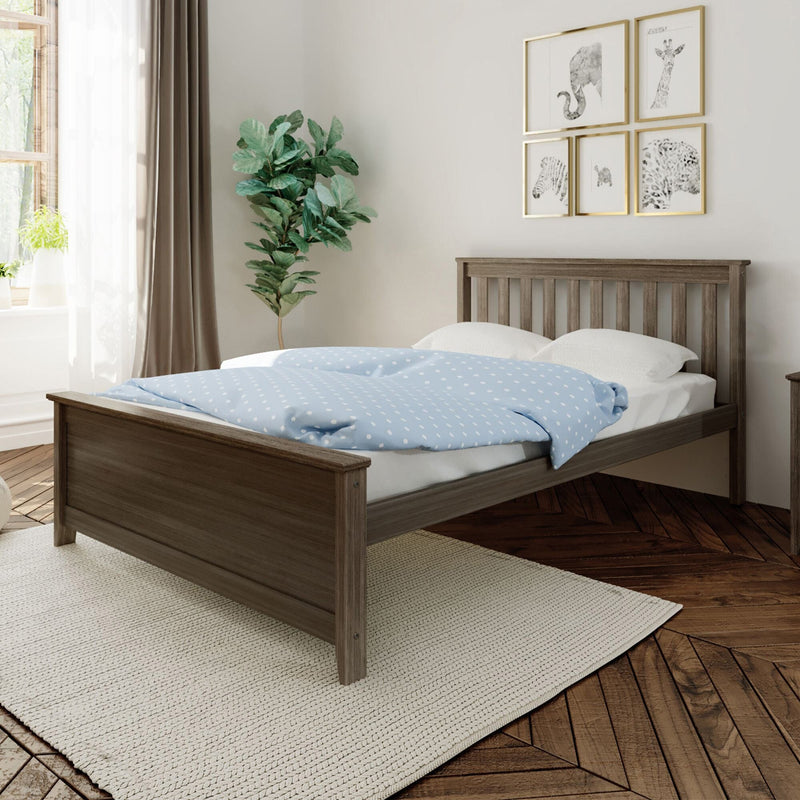Modern cozy bedroom with wooden bed frame, blue polka-dot duvet, white pillows, gold-framed animal wall art, fiddle leaf fig plant, sheer curtains and natural light on hardwood floors