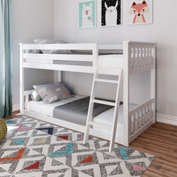 White wooden twin bunk bed with ladder in modern kids' bedroom, polka-dot bedding, animal wall art, colorful geometric rug