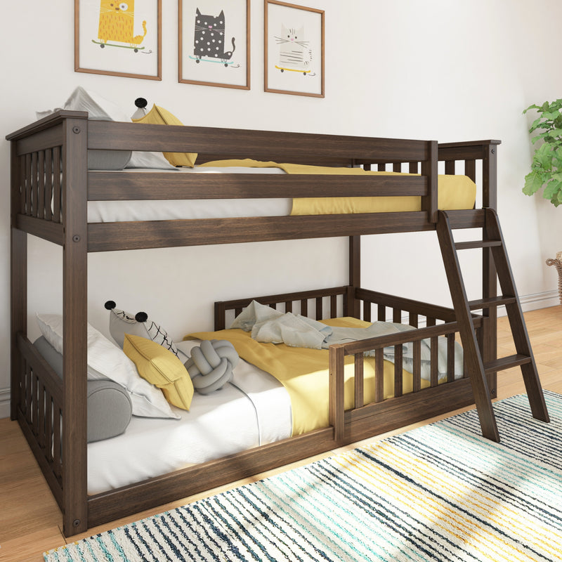 Dark wood twin bunk bed with ladder in modern kids bedroom, yellow bedding, decorative pillows, cat wall art and striped rug