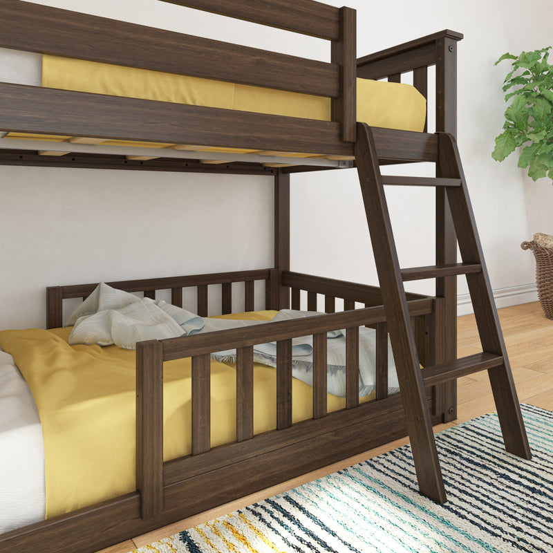 Solid dark walnut twin-over-twin bunk bed with ladder, yellow bedding and striped rug in a modern kids' bedroom with potted plant