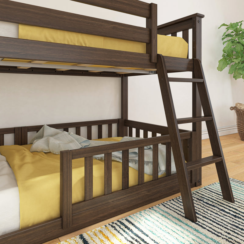 Dark walnut wooden bunk bed with ladder and yellow bedding in a modern kids' bedroom featuring slatted rails, striped area rug and potted plant