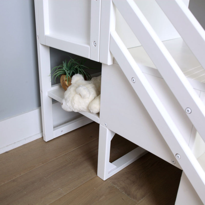 White wooden loft bed stairs with built-in storage shelves holding a plush teddy and potted succulent in a modern kids' bedroom design