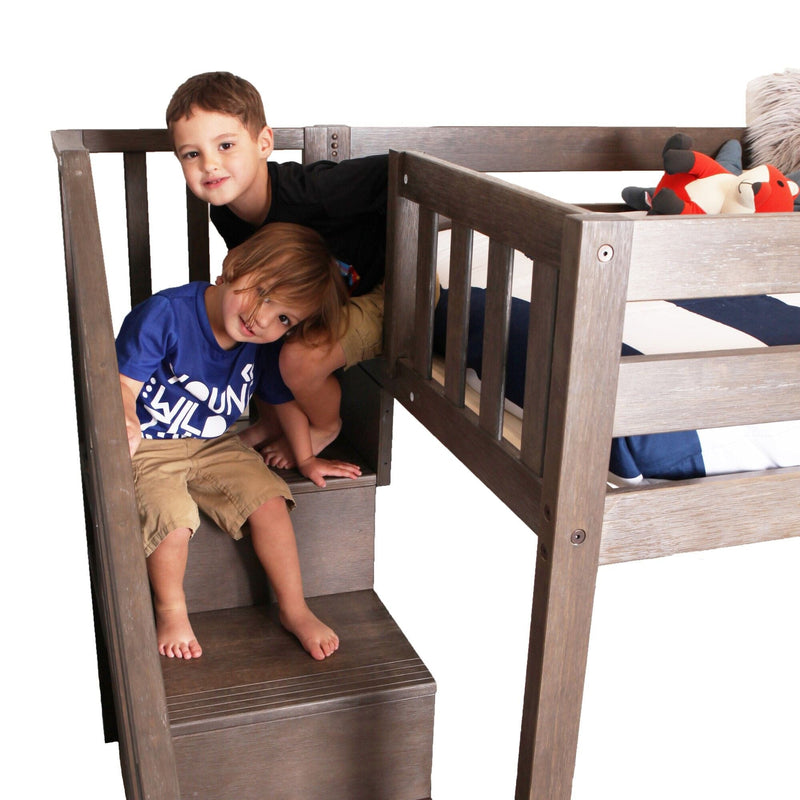 Two boys playing on a gray wooden loft bunk bed with built-in stairs and safety rails, twin mattress and red plush fox