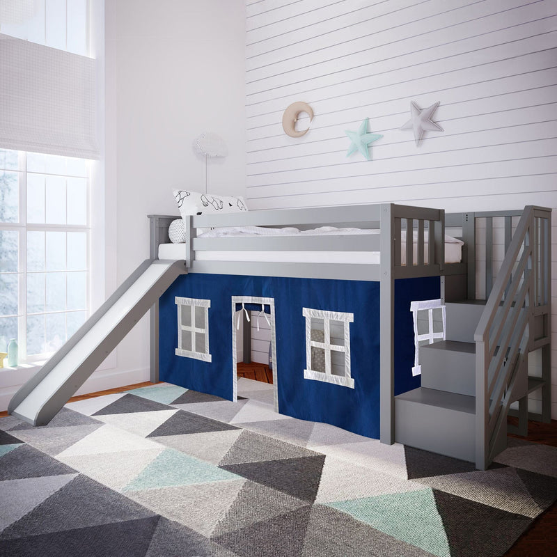 Children's loft bed with slide and stairs in a cozy bedroom, featuring blue playhouse curtains and geometric patterned rug.