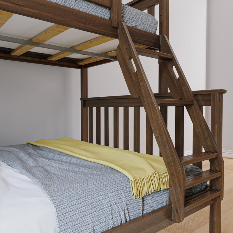 Solid dark wood bunk bed with built-in angled ladder, slatted guardrail, gray knitted blanket and yellow throw in a modern bedroom