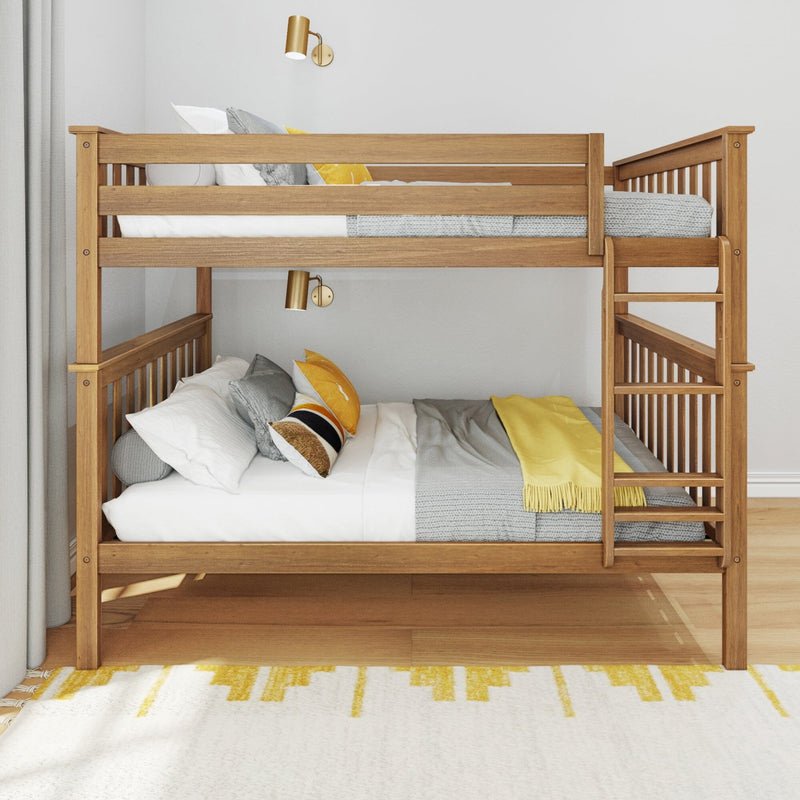 Twin-over-full wooden bunk bed in a modern kids' bedroom with gray and yellow bedding, ladder and guardrails, brass wall sconces, hardwood floor and yellow-patterned rug.