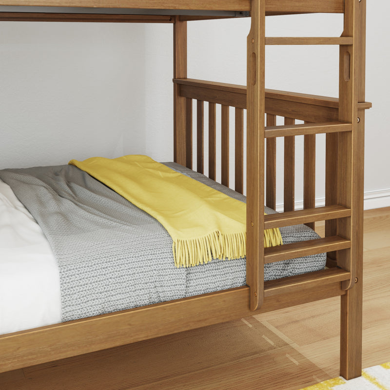 Natural wood bunk bed ladder and guardrail with gray knitted blanket and yellow throw on mattress in a modern kids' bedroom interior