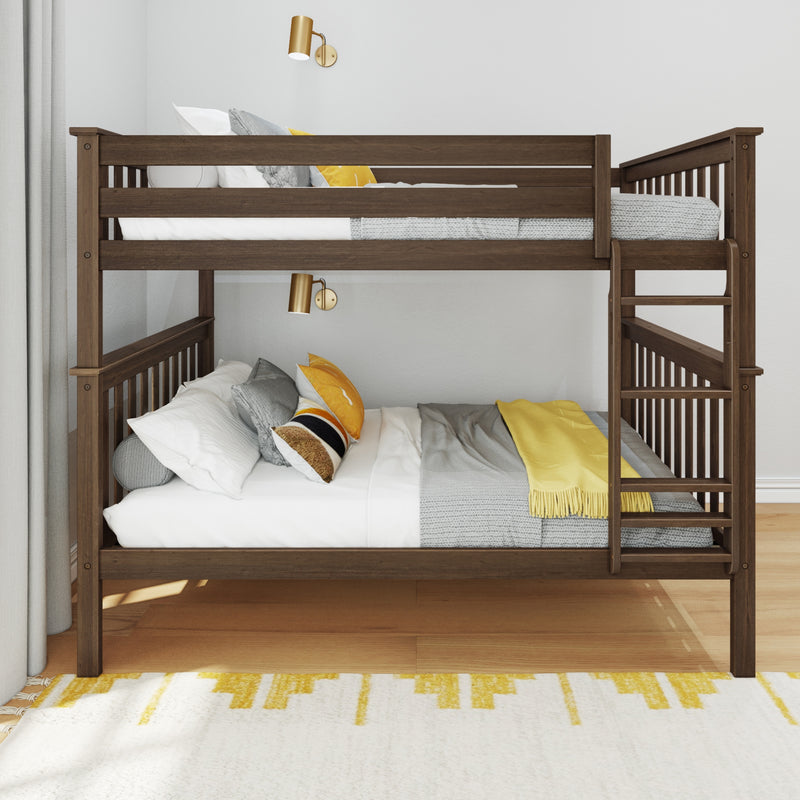 Solid dark wood bunk bed with ladder and guardrails in modern kids' bedroom, styled with gray knit bedding, yellow accent pillows and brass wall sconces