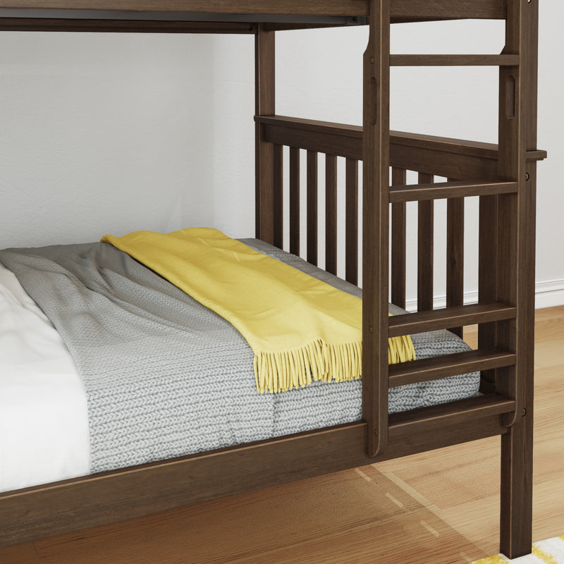 Modern solid wood bunk bed ladder and guardrail with gray knitted blanket and yellow throw on the lower bunk in a contemporary bedroom