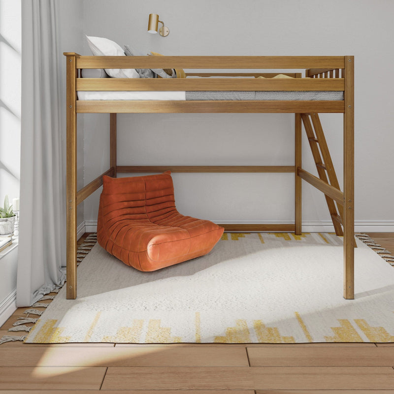 Modern natural wood loft bed with ladder over cozy reading nook featuring an orange lounge chair, textured white rug, gray curtains and brass wall lamp in a minimalist bedroom
