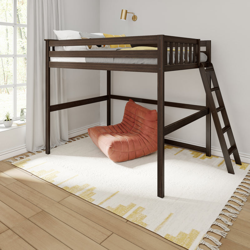 Dark wood loft bed with ladder and guardrail above a cozy orange floor chair, white curtains and sunlit window in a modern minimalist bedroom