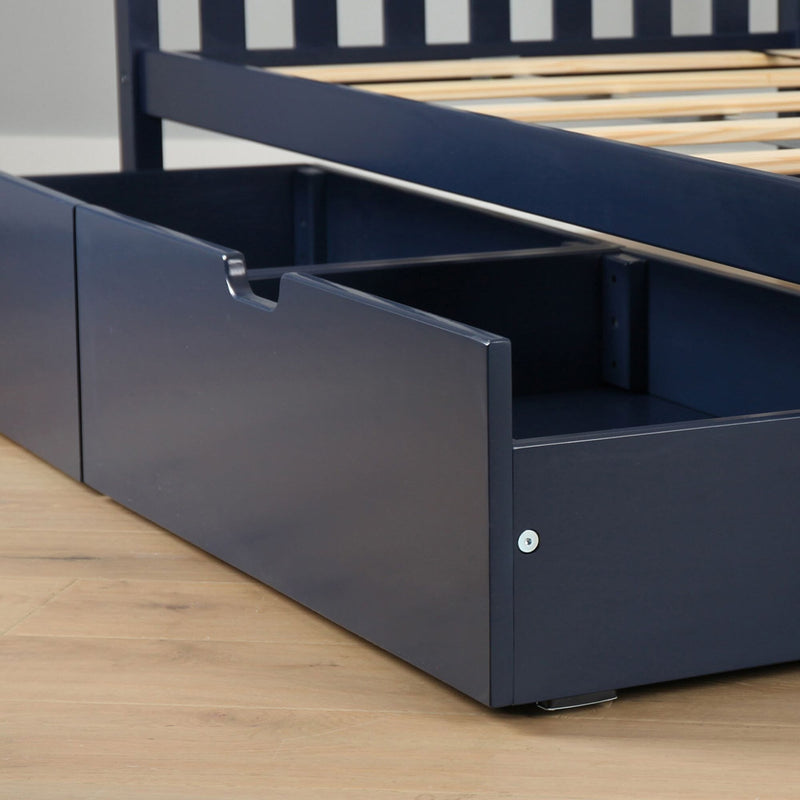 Navy blue wooden platform bed with slatted frame and built-in under-bed storage drawer with cutout handle on hardwood floor