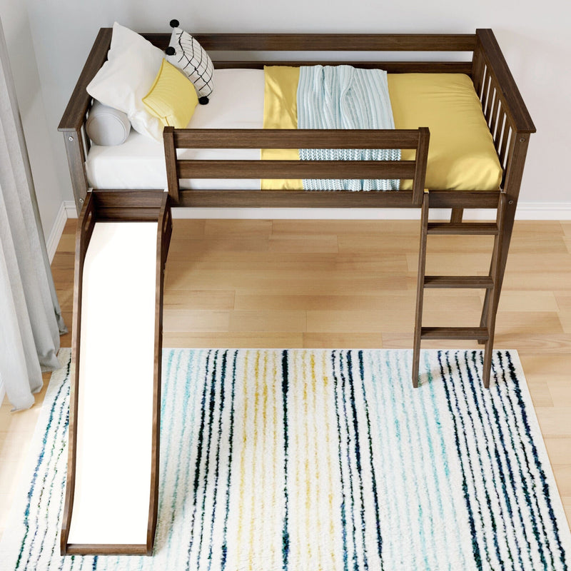 Loft bed with slide and ladder on wooden floor with striped rug in modern kids' room.